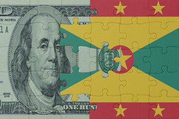 puzzle with the national flag of grenada and dollar money banknote. macro.concept.