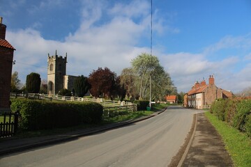 Bugthorpe, East Riding of Yorkshire, with St Andrew's Church on the left.