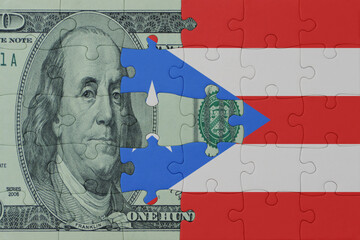 puzzle with the national flag of puerto rico and dollar money banknote. macro.concept.
