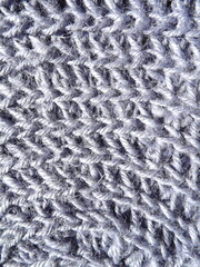 Crocheting of jute, yarn, raffia blue in a circle close-up as a background