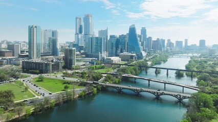 Austin Texas USA aerial drone footage of Colorado river parks with Downtown skyscrapers on cinematic background. Financial and residential buildings cityscape view on sunny summer day, 4K footage USA - Powered by Adobe