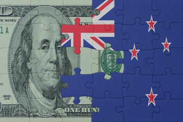 puzzle with the national flag of new zealand and dollar money banknote. macro.concept.
