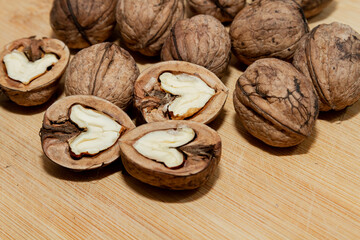 Walnut. Half walnut on natural background. Inshell nuts. Copyspace.