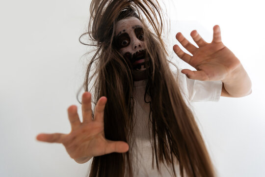 scary girl in white dress from horror film