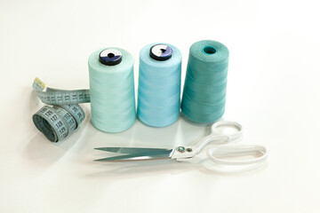 Sewing accessories and threads on table