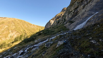 Fototapeta na wymiar pretty mountain ridge highland fast water cascade at summertime day - photo of nature