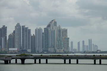 Tall modern skyscrapers in financial district of Panama City on grey cloudy day