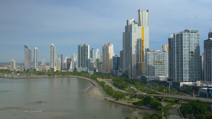 Fototapeta na wymiar Sunlight shines on tall skyscrapers of Panama City's modern financial district