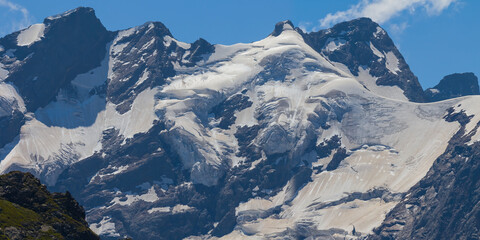 Naklejka premium closeup mountain chain in snow, summer mountain travel background