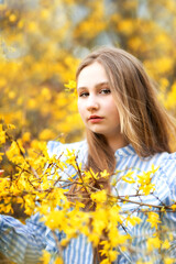 girl in yellow bush blossom
