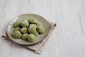 Homemade Soft Amaretti Cookies with Pistachio on a Plate, side view.