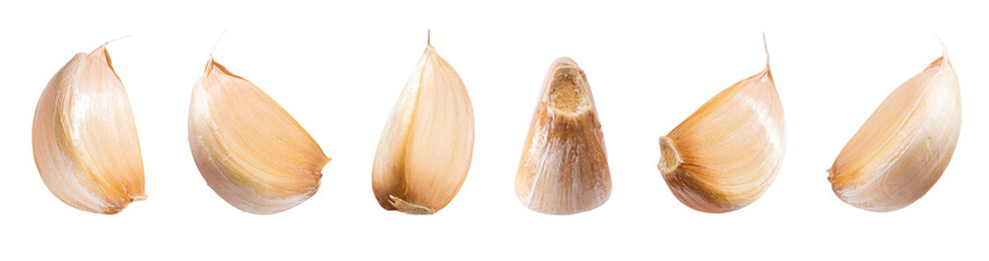 Falling peeled garlic cloves isolated on white background with clipping path. Food and spices...