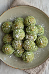 Homemade Soft Amaretti Cookies with Pistachio on a Plate, top view.