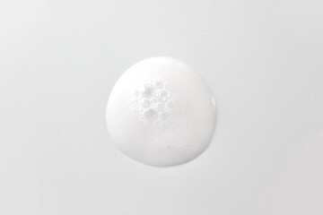 Drop of oxygen gel or serum on a white background. Sample of a cosmetic product. Selective focus.
