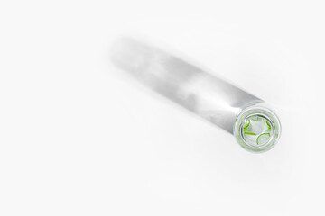 organic cosmetics, natural cosmetics, biofuels, algae. Natural green laboratory. Experiments. Glass laboratory jar with green plants on a light background.