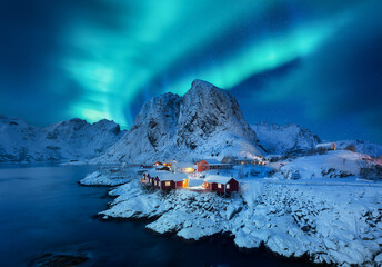 Aurora Borealis, Lofoten islands, Norway. View on the houses in the Hamnoy village, Lofoten...