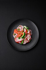 Delicious vegan salad of fresh vegetables of tomatoes, cucumbers and radishes