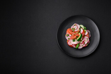 Delicious vegan salad of fresh vegetables of tomatoes, cucumbers and radishes
