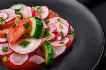 Delicious vegan salad of fresh vegetables of tomatoes, cucumbers and radishes