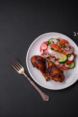Delicious nutritious dish consisting of grilled chicken legs with a salad