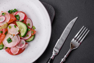 Delicious vegan salad of fresh vegetables of tomatoes, cucumbers and radishes