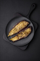 Delicious eggplant cut into two halves baked with salt, spices and herbs