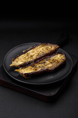 Delicious eggplant cut into two halves baked with salt, spices and herbs