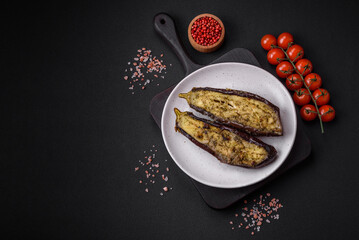 Delicious eggplant cut into two halves baked with salt, spices and herbs