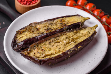 Delicious eggplant cut into two halves baked with salt, spices and herbs
