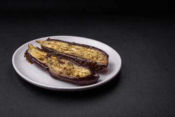 Delicious eggplant cut into two halves baked with salt, spices and herbs