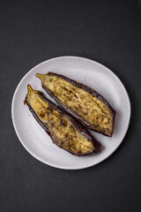 Delicious eggplant cut into two halves baked with salt, spices and herbs
