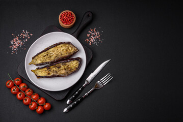 Delicious eggplant cut into two halves baked with salt, spices and herbs