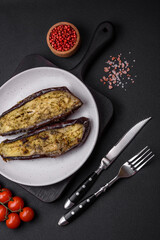 Delicious eggplant cut into two halves baked with salt, spices and herbs
