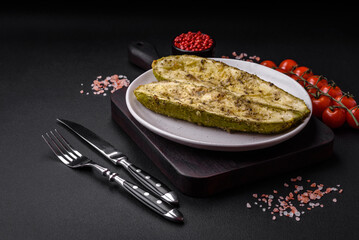 Delicious zucchini cut into two halves baked with salt, spices and herbs