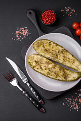 Delicious zucchini cut into two halves baked with salt, spices and herbs