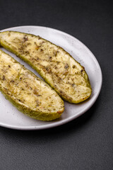 Delicious zucchini cut into two halves baked with salt, spices and herbs