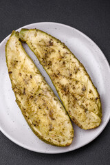 Delicious zucchini cut into two halves baked with salt, spices and herbs