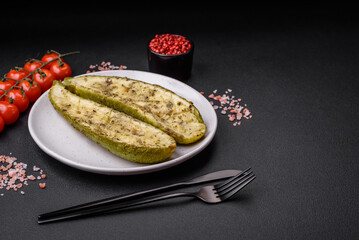 Delicious zucchini cut into two halves baked with salt, spices and herbs