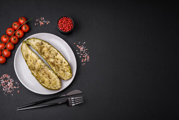 Delicious zucchini cut into two halves baked with salt, spices and herbs