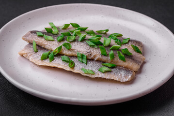 Delicious Atlantic herring marinated with salt and spices