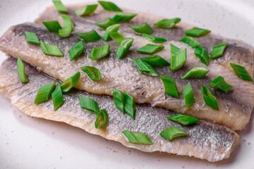 Delicious Atlantic herring marinated with salt and spices