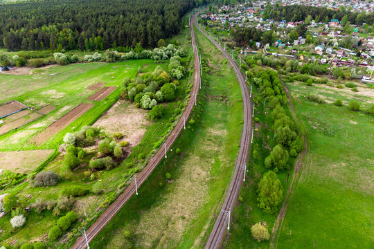 Aerial view of a railroad with two tracks in the countryside