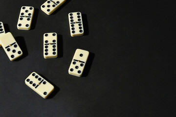 Dominoes on black background.