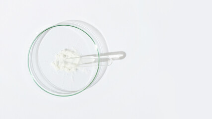 White powder in a Petri dish. Cocaine, cannabinoid, medicinal powder, antibiotic. lab, research.