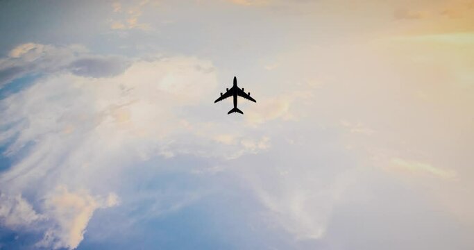 Overhead Flying Aircraft In The Blue Sky. The Plane With The Logo Express Delivery Service. The Sky And The Plane
