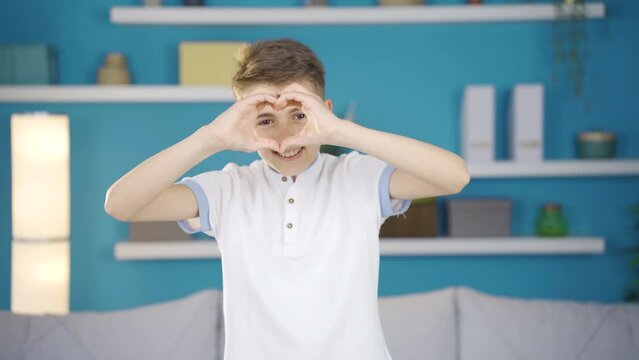 Boy in love making heart with love.