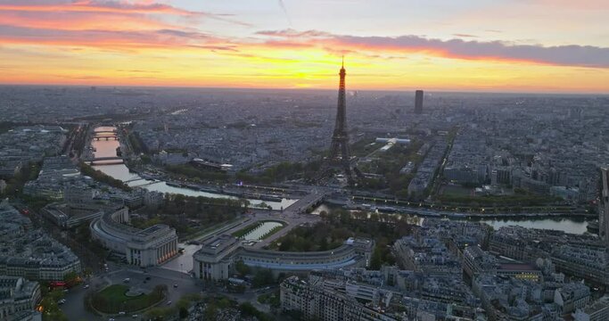 Beautiful view of famous Eiffel Tower in France with colorful twilight romantic sky. Wide establishing aerial morning sunrise or sunset of paris city center best travel destinations landmark in Europe