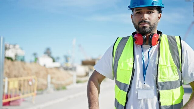 African american man builder smiling confident standing with arms crossed gesture at street