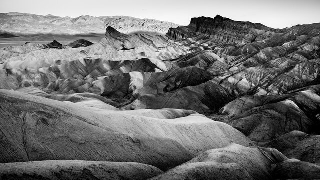 Black and White photo of the borax rich hills surrounding Zabriskie Point at sunrise in Death Valley National Park, California, USA