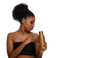 a woman applying moisturizing cream to her skin, smiling while holding a bottle demonstrating skin care